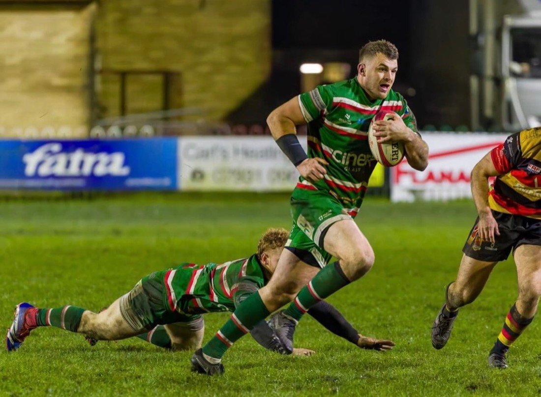 Ethan Phillips breaking through a tackle during a match for Ebbw Vale RFC